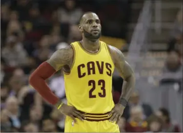  ?? TONY DEJAK — THE ASSOCIATED PRESS ?? LeBron James waits during a timeout in the first half against the Kings on Jan. 25 at Quicken Loans Arena.