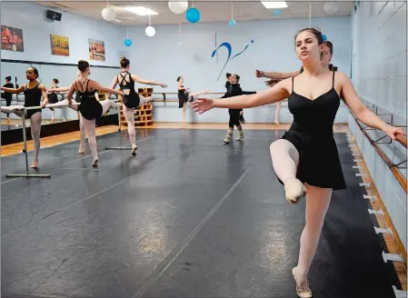  ?? SARAH GORDON/THE DAY ?? Sofia Priebe, 17, works on barre exercises during a dance class at The Dance Extension in New London. She is legally blind, and her parents have started a nonprofit, Sofia Sees Hope, to raise funds for research into and awareness of a rare genetic disease, Leber congenital amaurosis.