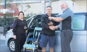  ??  ?? NEW WHEELS: Grampians Community Health’s Kristy Price and Luke Bibby receive the keys to a brand new Toyota Spade mobility vehicle from Grampians Toy Club’s Jamie Erwin.