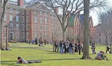  ?? STEVE SZYDLOWSKI/ THE PROVIDENCE JOURNAL, FILE ?? Students congregate on the Brown University campus in 2018.