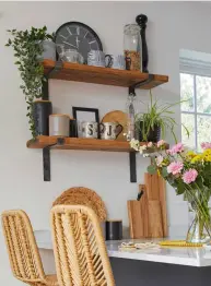  ??  ?? ‘We chose open shelves to encourage a sense of space in the narrow room. We made the shelves ourselves from scaffold boards and some £11 brackets from Etsy. I’ve used lots of textures to make the room visually appealing, but sticking to a simple colour palette gives a cohesive finish’