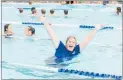  ??  ?? Mayor Alex Walker arose to the challenge, taking her first dip in the newly refurbishe­d pool.