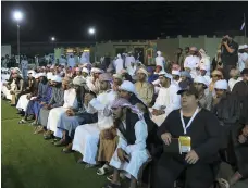  ?? Satish Kumar for the National ?? At night, visitors to the Al Dhafra Festival listen to poetry inspired by a range of themes, including the beauty of camels such as Batoola, left, who on Sunday was crowned the most beautiful three-year-old Emirati camel