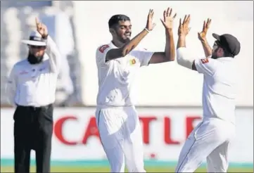  ?? AFP ?? Lasith Embuldeniy­a (centre) took 5-66 in the second innings and six wickets in the match on his Test debut at Kingsmead.