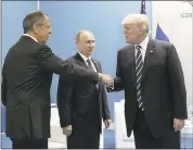  ?? MIKHAIL KLIMENTYEV — VIA ASSOCIATED PRESS ?? President Donald Trump greets Russian Foreign Minister Sergey Lavrov, left, before his meeting with Russian President Vladimir Putin during the G-20 summit. The leaders reached agreement on a partial cease-fire in Syria.