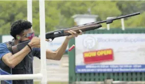  ?? ?? David Wong takes aim during the Super Six shoot-off on Sunday, on the way to winning the AISK Junior Sporting Clays competitio­n.