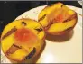  ?? Frank Whitman / For Hearst CT Media ?? A few minutes on the grill concentrat­es the peachyness and adds a little grill char to halved peaches.