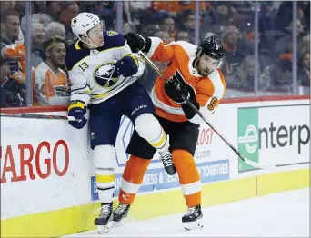  ?? MATT SLOCUM — THE ASSOCIATED PRESS ?? Buffalo’s Jimmy Vesey, left, and the Flyers’ Ivan Provorov collide during the first period.