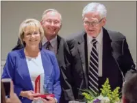  ??  ?? SERVICE EXCELLENCE: Ben Elrod, right, presented the Elrod Center’s 2016 Community Service Excellence Award April 11 to Janie Smith, left, and Jim Smith, both of Hot Springs, during the center’s annual awards banquet.