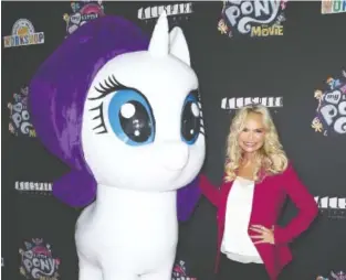  ?? STARMAX/NEWSCOM/ZUMA PRESS/TRIBUNE NEWS SERVICE ?? Kristin Chenoweth, who voices the character Princess Skystar in “My Little Pony: The Movie,” stands with Rarity at the film’s New York premiere.