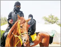  ??  ?? In this Saturday, Aug 24, 2019 photo, Saudi women ride horses during the
al-Soudah festival in Abha, southwest Saudi Arabia. (AP)