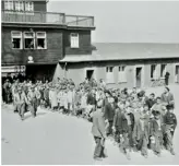  ??  ?? Above Lily’s necklace, which she kept throughout her internment. Below Internees from Buchenwald on their way to receive treatment after liberation