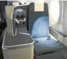  ??  ?? Business seat reclines to flat bed.