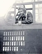  ??  ?? Briggs looking out of the cockpit of a Lancaster bomber: he was involved in more than 60 operations with Bomber Command’s Pathfinder Force