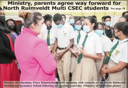  ?? (Ministry of Education photo) ?? Minister of Education, Priya Manickchan­d (left) speaking with students of the North Ruimveldt Multilater­al Secondary School following the meeting yesterday.