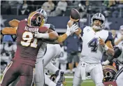  ?? ASSOCIATED PRESS FILE PHOTO ?? Washington Redskins linebacker Ryan Kerrigan, left, pressures Dallas Cowboys quarterbac­k Dak Prescott as Prescott throws a pass in a Nov. 30 game in Arlington, Texas. The Cowboys face the New York Giants on Sunday in East Rutherford, N.J.