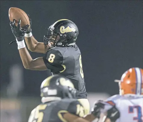  ?? Steph Chambers/Post-Gazette ?? Gateway’s Derrick Davis has risen above his freshman status to give quarterbac­k Brady Walker a solid target at wide receiver.