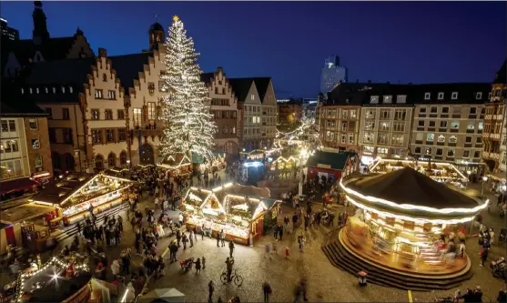  ?? Michael
probst / ap ?? lights illuminate the christmas market in Frankfurt, Germany, on monday.