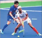  ?? AP ?? Japan's Masaki Ohashi (left) vies for possession with Mandeep.