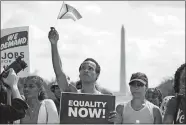  ?? JACQUELYN MARTIN/AP FILE PHOTO ?? People listen to speakers during the 60th anniversar­y of the March on Washington at the Lincoln Memorial in Washington in August. On the anniversar­y, attention was called to a nationwide backlash against LGBTQ+ rights. Some Black LGBTQ+ participan­ts felt that their speaking slots minimized their contributi­ons in civil rights.