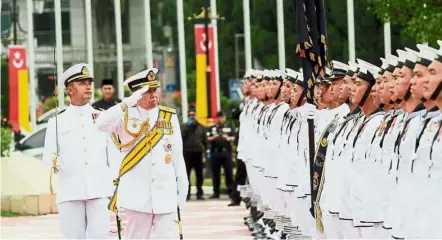  ??  ?? Special day: Sultan Sharafudin inspecting the guard of honour at the Warriors' Day celebratio­n in Shah Alam.
