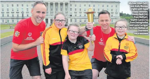  ?? PHILIP MAGOWAN ?? Michael Allen (left) and Andy Watson (right) with Team Ulster athletes, Kirsty Neill (16)
from Belfast), Sophie Caron (13) from Donaghadee and Lucia Carrigan (10) from Belfast at
Stormont