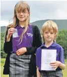  ??  ?? Rona and Seumas McIntyre, who both took home top prizes in their competitio­n. Rona won first place for fiddle, and brother Seumas received third for his poetry recitation. 21_ F26 Ardnamurch­an MOD 8_ Rona& Seumas McIntyre