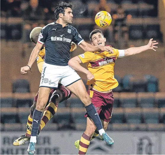  ?? SNS. ?? Dundee striker Sofien Moussa, who saw his headed ‘goal’ controvers­ially ruled out, battles with Carl McHugh and Cedric Kipre.