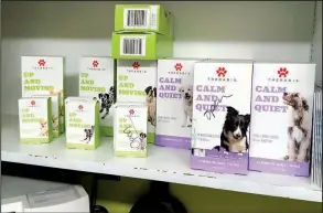  ?? AP ?? Marijuana extract products sit on display at a veterinary clinic in Bend, Ore. The effectiven­ess of such products to treat dogs’ joint pain and anxiety is unknown.