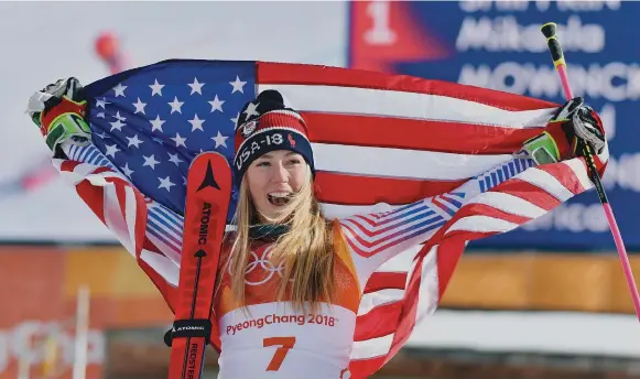  ?? Hyoung Chang, The Denver Post ?? Mikaela Shiffrin celebrates winning a gold medal in the giant slalom at the 2018 Pyeongchan­g Winter Games.