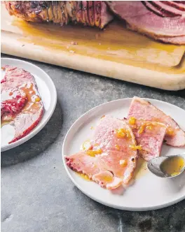  ??  ?? The recipe for this glazed spiral-sliced ham is in the cookbook All-Time Best Holiday Entertaini­ng.