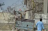  ?? (AFP) ?? This file photo shows Afghan wrestlers and residents at the entrance of Maiwand Club after a blast, in Kabul on September 6