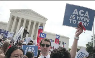  ?? MARK WILSON/ GETTY IMAGES ?? People celebrate in front of the U. S. Supreme Court in Washington on Thursday after a ruling was announced on the Affordable Care Act. The high court ruled that 8.7 million Americans are entitled to continue receiving nationwide tax subsidies intended...