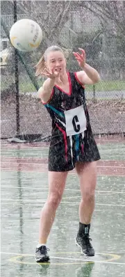  ??  ?? Right: Warragul centre Hayley Roberts restarts play as the rain pours down at Western Park during A grade on Saturday. The Gulls won 45-39 and now sit fifth on the ladder.Photograph­s by Paul Cohen.