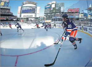  ?? ADAM HUNGER / AP ?? JT Miller in possession for the New York Rangers during the first period of the NHL Winter Classic hockey game against the Buffalo Sabres at Citi Field in New York on Monday. Miller scored the winner as the Rangers won 3-2 in overtime.