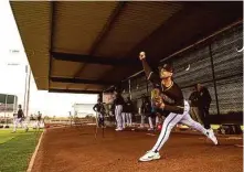  ?? Matt Thomas/San Diego Padres/Getty Images ?? Right-hander Nick Martinez of the Padres throws during the daily workout at the Peoria (Ariz.) Sports Complex.