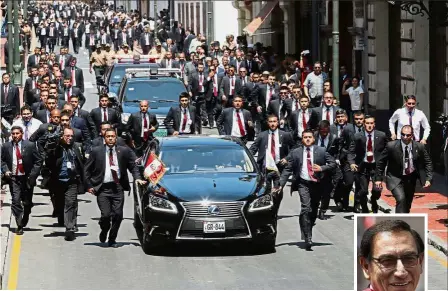  ?? — Reuters/AP ?? Officially in: Vizcarra (inset) leaving the congress building in a motorcade after being sworn in as president in Lima.