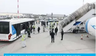  ??  ?? Kuwaiti citizens leave a Kuwait Airways plane after its arrival from Abu Dhabi yesterday.