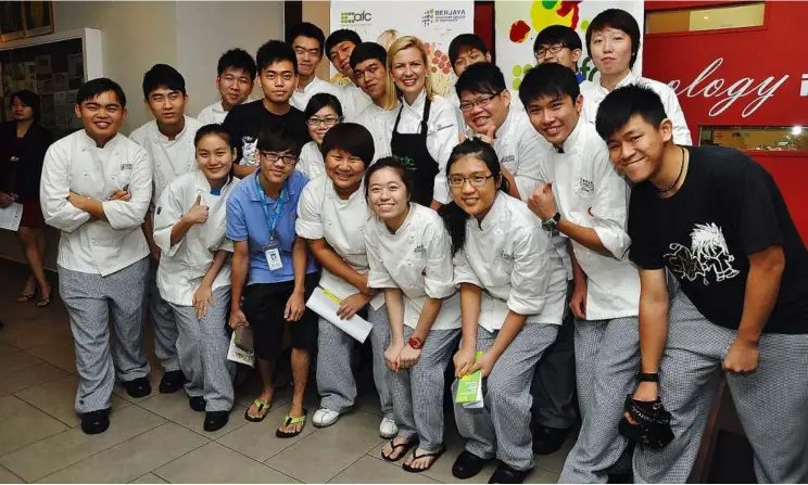  ??  ?? Famed Canadian celebrity chef showcases her culinary talents and baking prowess in the latest edition of Culinary Masterpiec­es. Here she poses with the BERJAYA UCH students.