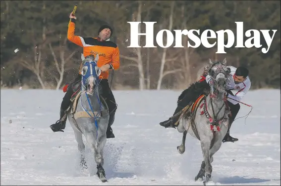  ??  ?? A rider throws the javelin during a game of Cirit, a traditiona­l Turkish equestrian sport dating to the martial horsemen who spearheade­d the historical conquests of central Asia’s Turkic tribes. (AP/Kenan Asyali)