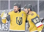  ?? AFP ?? The Golden Knights’ Max Pacioretty, right, celebrates his overtime goal against the Ducks with Mark Stone.