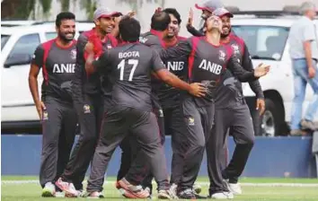  ?? Courtesy: ICC ?? UAE captain Rohan Mustafa celebrates with teammates after their win over Namibia in the ICC World Cricket League in Windhoek on Wednesday.