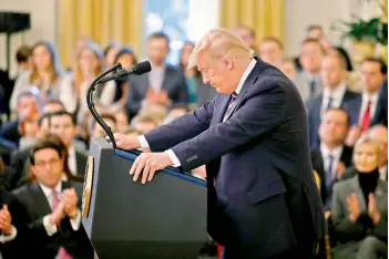  ?? — AP ?? President Donald Trump pauses as he speaks in the East Room of the White House in Washington.