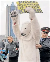  ??  ?? Polar perp: Environmen­talists like this protester aren’t the biggest problem facing Gazprom, the Russian energy firm under Western sanctions.