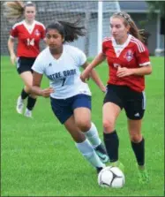  ?? JOHN BREWER - ONEIDA DAILY DISPATCH ?? VVS midfielder Taylir Doig dribbles past Notre Dame’s Sara Raja during Tuesday’s Tri-Valley League contest.