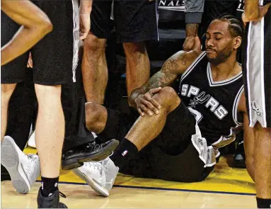  ?? JOSE CARLOS FAJARDO / BAY AREA NEWS GROUP ?? There’s no timetable for Kawhi Leonard’s return after the Spurs star’s left ankle was reinjured Sunday during the third quarter of the Game 1 loss to Golden State in the Western Conference finals.