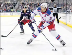  ?? AP PHOTO ?? In this Oct. 13, 2017, file photo, New York Rangers defenceman Ryan McDonagh, right, looks to pass in front of Columbus Blue Jackets forward Matt Calvert during an NHL hockey game in Columbus, Ohio.