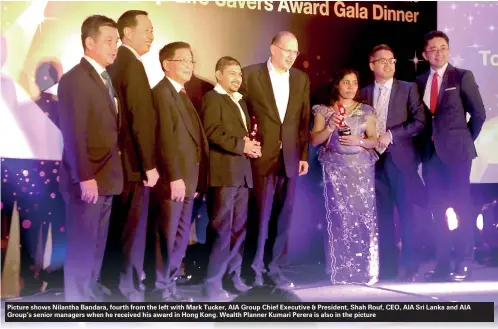  ??  ?? Picture shows Nilantha Bandara, fourth from the left with Mark Tucker, AIA Group Chief Executive & President, Shah Rouf, CEO, AIA Sri Lanka and AIA Group’s senior managers when he received his award in Hong Kong. Wealth Planner Kumari Perera is also in...