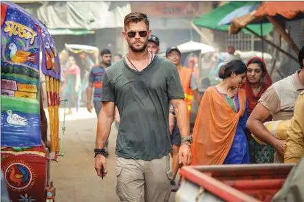  ?? Jasin Boland photos/Netflix via Associated Press ?? This image released by Netflix shows Chris Hemsworth in a scene from “Extraction,” premiering this week on Netflix.