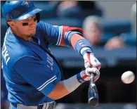  ?? AP PHOTO/KATHY WILLENS ?? Toronto Blue Jays Troy Tulowitzki hits a seventh-inning single in a baseball game against the New York Yankees in New York, Wednesday.